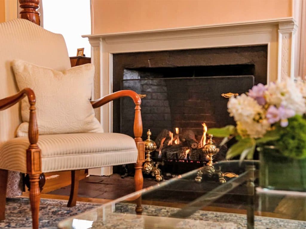 Relax and unwind in front of the fireplace in the guest rooms at our gorgeous getaway in New Hampshire!