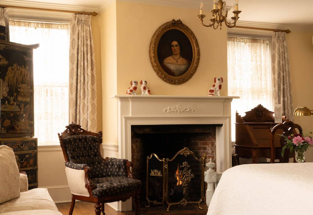 A gorgeous guest room and fireplace at our Exeter NH Hotels, one of the best places for romantic getaways in NH