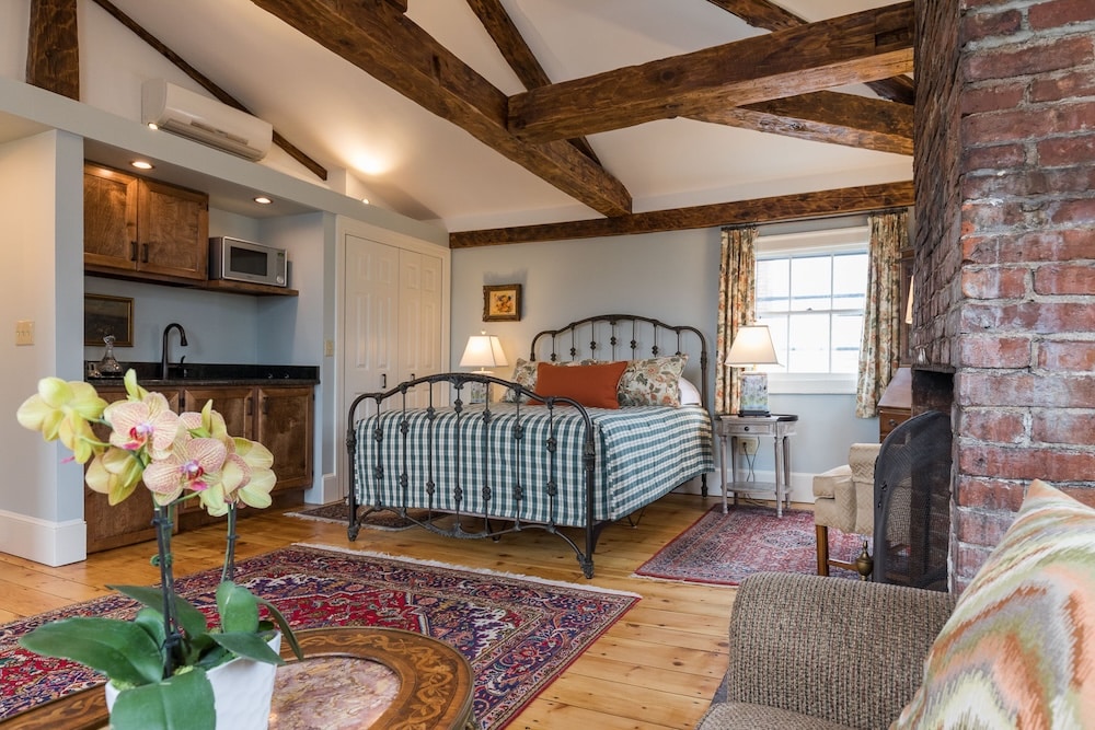 A guest room with a kitchenette - stay at one of the best family-friendly hotels in Exeter, NH