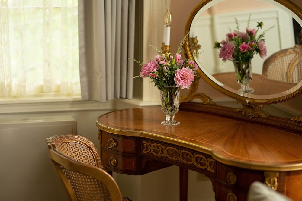 Where to Find the Best Fall Colors in New Hampshire 8 beautiful flowers on an antique desk at our luxury boutique hotel in Exeter, NH